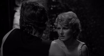 Movie still from “Rumble Fish” (1983), directed by Francis Ford Coppola – A man and a woman talking to each other; Close Up shot, Over the shoulder angle