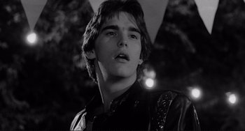 Movie still from “Rumble Fish” (1983), directed by Francis Ford Coppola – A young man in a leather jacket looking at the camera; Close Up shot, Low angle