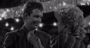 Movie still from “Rumble Fish” (1983), directed by Francis Ford Coppola – A black and white photo of a man and a woman; Close Up shot, Over the shoulder angle