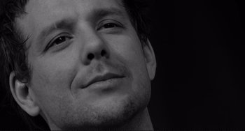 Movie still from “Rumble Fish” (1983), directed by Francis Ford Coppola – Black and white photograph of a man's face; Close Up shot, Low angle