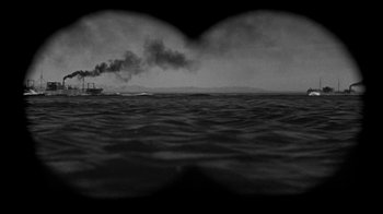 Movie still from “Run Silent Run Deep” (1958), directed by Robert Wise – A boat in the middle of the ocean with smoke billowing from it; Extreme Wide shot, Low angle