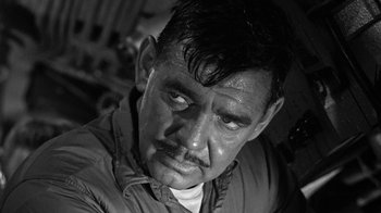 Movie still from “Run Silent Run Deep” (1958), directed by Robert Wise – An old man with a mustache and a beard; Close Up shot, Low angle