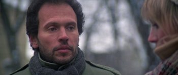 Movie still from “Running Scared” (1986), directed by Peter Hyams – A person wearing a scarf; Close Up shot, Low angle