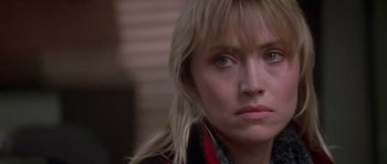 Movie still from “Running Scared” (1986), directed by Peter Hyams – A person wearing a jacket; Close Up shot, Over the shoulder angle