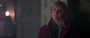 Movie still from “Running Scared” (1986), directed by Peter Hyams – A woman wearing a red and black plaid jacket; Close Up shot, Over the shoulder angle