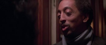 Movie still from “Running Scared” (1986), directed by Peter Hyams – A person with a beard; Close Up shot, Over the shoulder angle