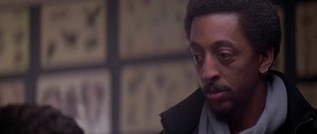 Movie still from “Running Scared” (1986), directed by Peter Hyams – A person wearing a jacket; Close Up shot, Low angle