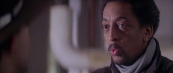 Movie still from “Running Scared” (1986), directed by Peter Hyams – A person with a beard and mustache; Close Up shot, Low angle