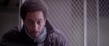 Movie still from “Running Scared” (1986), directed by Peter Hyams – A person wearing a leather jacket; Close Up shot, Over the shoulder angle