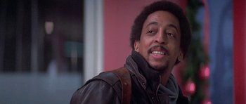 Movie still from “Running Scared” (1986), directed by Peter Hyams – A person wearing a leather jacket; Close Up shot, Low angle