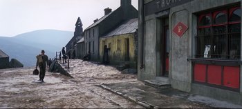 Movie still from “Ryan's Daughter” (1970), directed by David Lean – A street scene with a person standing on the side of the road; Extreme Wide shot, High angle