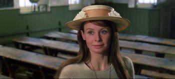 Movie still from “Ryan's Daughter” (1970), directed by David Lean – A woman wearing a straw hat with flowers on it; Close Up shot, High angle