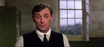 Movie still from “Ryan's Daughter” (1970), directed by David Lean – A person wearing a vest and a tie; Close Up shot, Low angle
