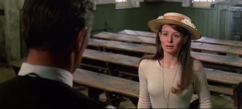 Movie still from “Ryan's Daughter” (1970), directed by David Lean – A man and a woman are standing in front of wooden benches; Close Up shot, Over the shoulder angle