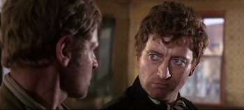 Movie still from “Ryan's Daughter” (1970), directed by David Lean – A man looking at another man in a mirror; Close Up shot, Over the shoulder angle