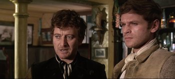 Movie still from “Ryan's Daughter” (1970), directed by David Lean – A man and a woman standing next to each other in a room; Close Up shot, Low angle