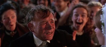 Movie still from “Ryan's Daughter” (1970), directed by David Lean – An old man with a frowning look on his face; Close Up shot, Over the shoulder angle