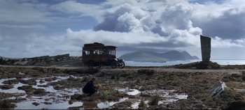 Movie still from “Ryan's Daughter” (1970), directed by David Lean – An old bus parked on the side of the road; Extreme Wide shot, Low angle