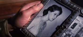 Movie still from “Ryan's Daughter” (1970), directed by David Lean – A person holding a picture of a woman in a dress; Extreme Close Up shot, High angle