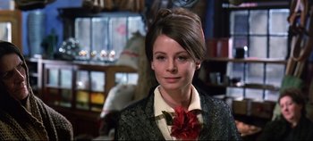 Movie still from “Ryan's Daughter” (1970), directed by David Lean – A woman with a flower in her hair and wearing a suit; Close Up shot, Over the shoulder angle