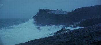 Movie still from “Ryan's Daughter” (1970), directed by David Lean – Several people are standing on a cliff by the ocean; Extreme Wide shot, Low angle
