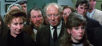 Movie still from “Ryan's Daughter” (1970), directed by David Lean – A group of men and women standing next to each other; Close Up shot, Low angle