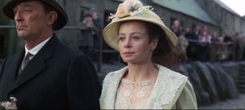 Movie still from “Ryan's Daughter” (1970), directed by David Lean – A woman wearing a hat with flowers on top of her head; Close Up shot, Low angle