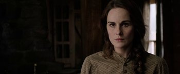 Movie still from “Godless” (2017), directed by Scott Frank – A person wearing a shirt; Close Up shot, Over the shoulder angle