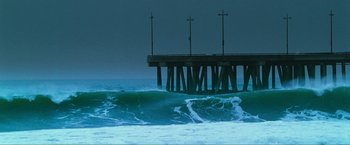 Movie still from “S.W.A.T.” (2003), directed by Clark Johnson – A pier in the middle of the ocean at night; Extreme Wide shot, High angle