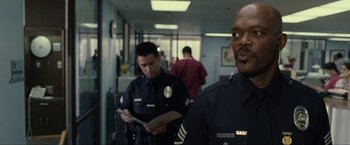 Movie still from “S.W.A.T.” (2003), directed by Clark Johnson – Two police officers standing next to each other in a hallway; Close Up shot, Over the shoulder angle