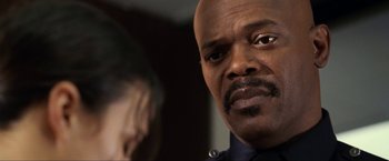 Movie still from “S.W.A.T.” (2003), directed by Clark Johnson – A person wearing a police uniform; Close Up shot, Over the shoulder angle