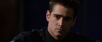 Movie still from “S.W.A.T.” (2003), directed by Clark Johnson – A person wearing a police uniform; Close Up shot, Low angle