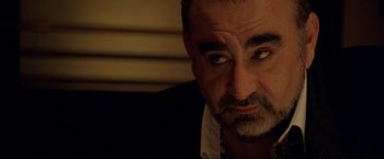 Movie still from “S.W.A.T.” (2003), directed by Clark Johnson – A person looking at the camera; Close Up shot, Over the shoulder angle