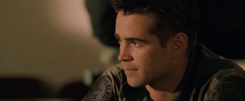 Movie still from “S.W.A.T.” (2003), directed by Clark Johnson – A person wearing a military uniform; Close Up shot, Over the shoulder angle