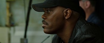 Movie still from “S.W.A.T.” (2003), directed by Clark Johnson – A person wearing a hat; Close Up shot, Low angle