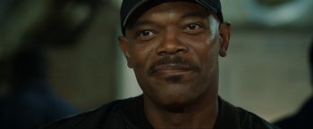 Movie still from “S.W.A.T.” (2003), directed by Clark Johnson – A person wearing a hat; Close Up shot, Low angle