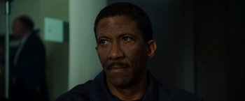 Movie still from “S.W.A.T.” (2003), directed by Clark Johnson – A person wearing a shirt; Close Up shot, High angle