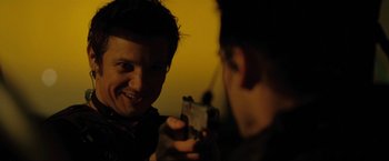 Movie still from “S.W.A.T.” (2003), directed by Clark Johnson – A man taking a picture of another man holding a camera; Close Up shot, Over the shoulder angle