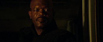 Movie still from “S.W.A.T.” (2003), directed by Clark Johnson – A person in a dark room; Close Up shot, Low angle