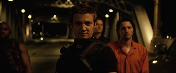 Movie still from “S.W.A.T.” (2003), directed by Clark Johnson – A group of men standing next to each other; Medium shot, Low angle