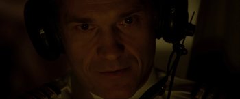 Movie still from “S.W.A.T.” (2003), directed by Clark Johnson – A person wearing headphones; Close Up shot, Low angle