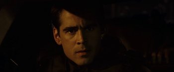 Movie still from “S.W.A.T.” (2003), directed by Clark Johnson – A person in a dark room; Close Up shot, Over the shoulder angle