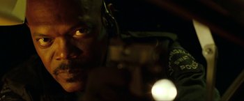 Movie still from “S.W.A.T.” (2003), directed by Clark Johnson – A man's face in the dark; Close Up shot, Low angle