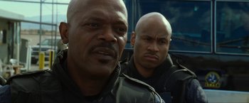 Movie still from “S.W.A.T.” (2003), directed by Clark Johnson – A couple of men standing next to each other; Close Up shot, Low angle