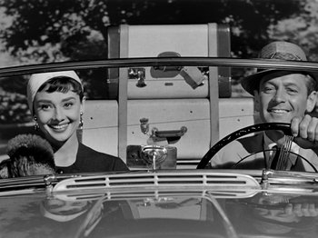 Movie still from “Sabrina” (1954), directed by Billy Wilder – A man and a woman sitting in the back seat of a car; Medium shot, Low angle