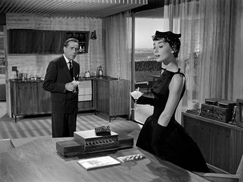 Movie still from “Sabrina” (1954), directed by Billy Wilder – A man and a woman in a room; Medium shot, Low angle