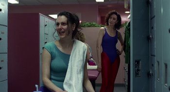 Movie still from “Safe” (1995), directed by Todd Haynes – Two women are standing in a room and one is holding a towel in her hand; Medium shot, Over the shoulder angle