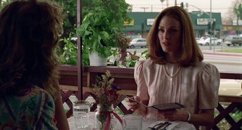 Movie still from “Safe” (1995), directed by Todd Haynes – Two women are sitting at a table in a restaurant; Medium shot, Over the shoulder angle