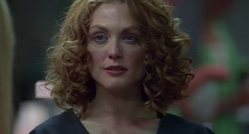 Movie still from “Safe” (1995), directed by Todd Haynes – A person with curly red hair; Close Up shot, Low angle