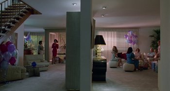 Movie still from “Safe” (1995), directed by Todd Haynes – A group of people sitting in a living room; Extreme Wide shot, High angle